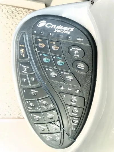  Yacht Photos Pics Control panel of 2006 Cruisers Yachts 420 Express with various buttons and functions.