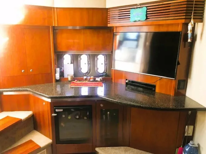  Yacht Photos Pics Luxurious interior of 2006 Cruisers Yachts 420 Express with wood cabinetry and modern amenities.