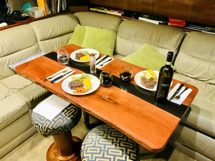  Yacht Photos Pics Dining area inside 2006 Cruisers Yachts 420 Express with elegant table setting and wine.