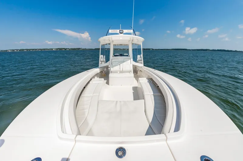 Hi Yacht Photos Pics 2020 Regulator 34 Center Console boat on open water under clear blue sky.