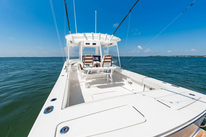 Hi Yacht Photos Pics 2020 Regulator 34 Center Console boat on open water under clear blue sky.
