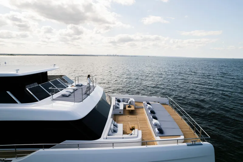  Yacht Photos Pics Luxurious 2026 Sunreef 100 Power yacht on open sea, featuring spacious deck and elegant design.