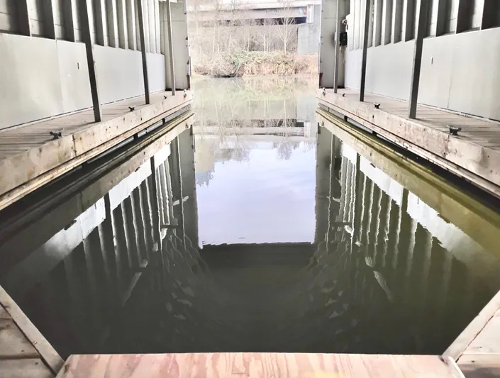  Yacht Photos Pics Custom 2013 boathouse interior with waterway and open doors.