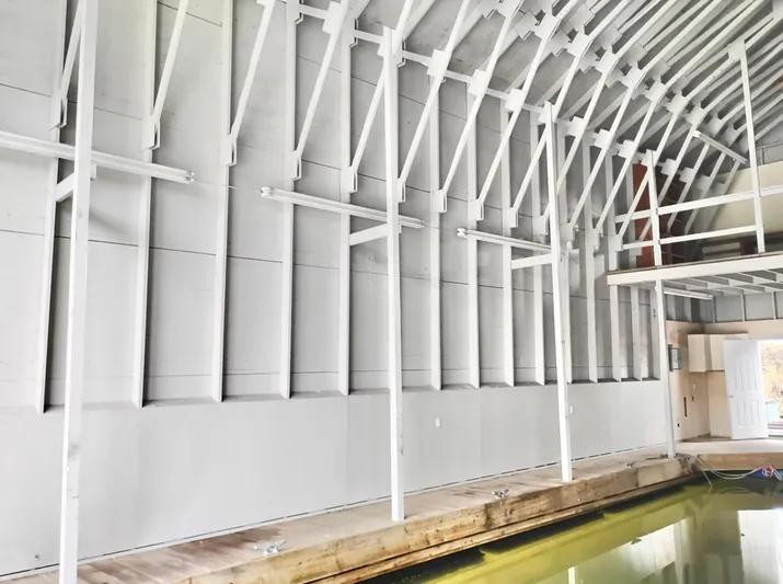  Yacht Photos Pics Interior of a custom boathouse with high ceilings and wooden dock, built in 2013.