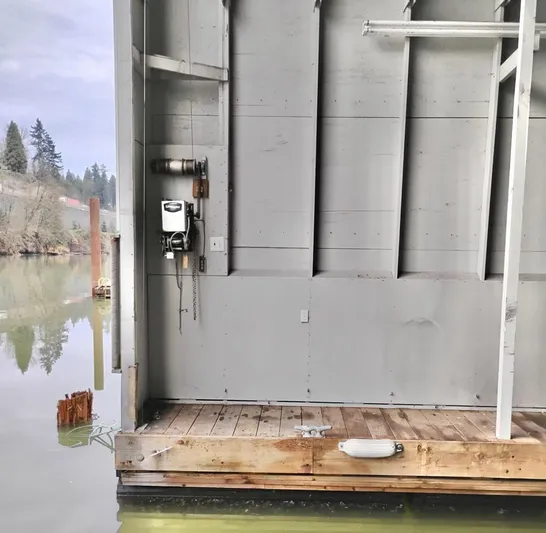  Yacht Photos Pics Custom 2013 boathouse interior with wooden dock and water view.