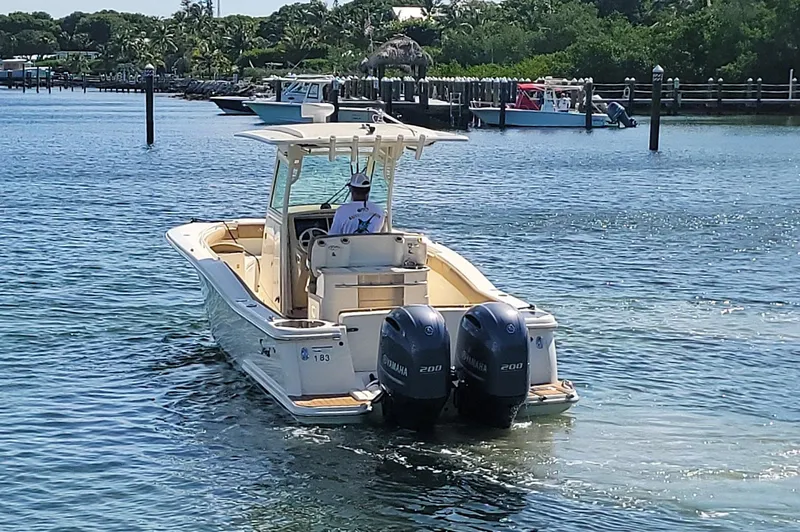  Yacht Photos Pics 2018 Scout 275 LXF boat cruising on a sunny day with twin Yamaha engines.