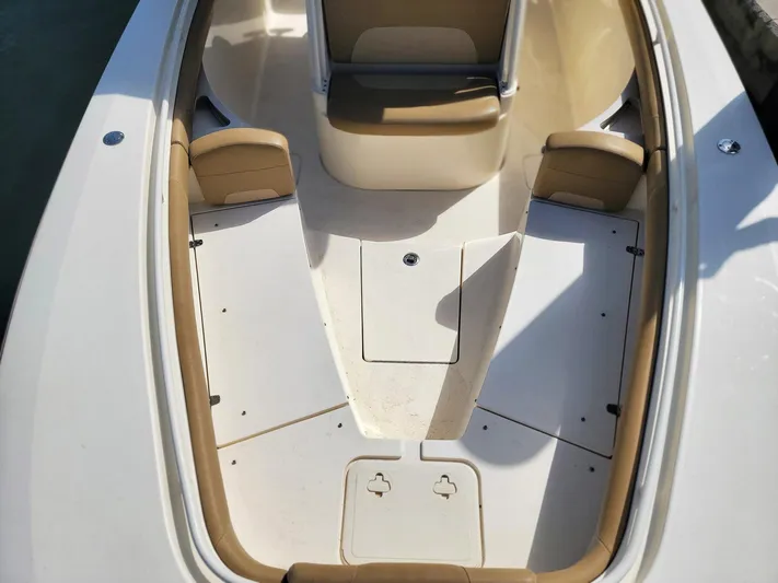  Yacht Photos Pics 2018 Scout 275 LXF boat interior with tan seating and white deck.