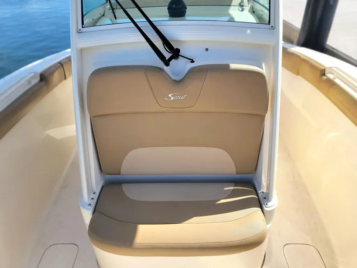  Yacht Photos Pics 2018 Scout 275 LXF boat seat with beige upholstery and logo.