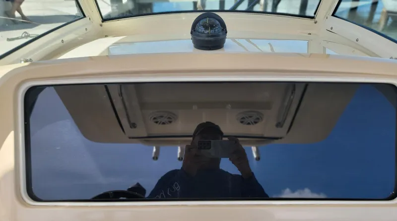  Yacht Photos Pics 2018 Scout 275 LXF boat dashboard with compass and reflection.