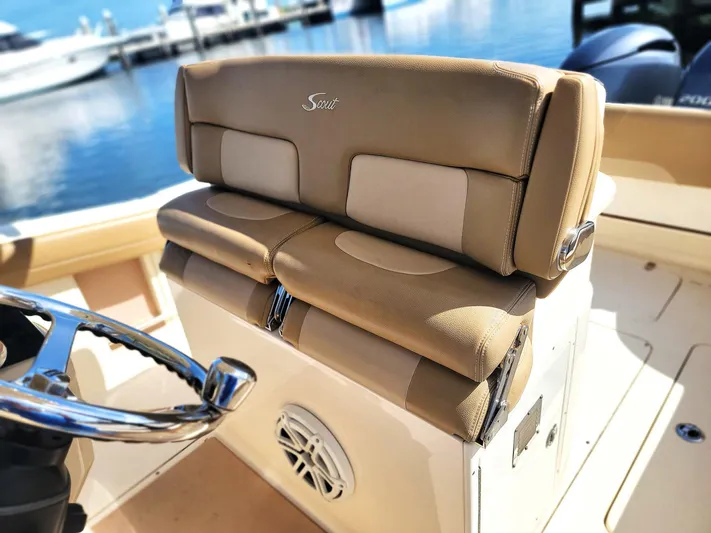  Yacht Photos Pics Luxury seating on 2018 Scout 275 LXF boat, featuring tan leather upholstery.