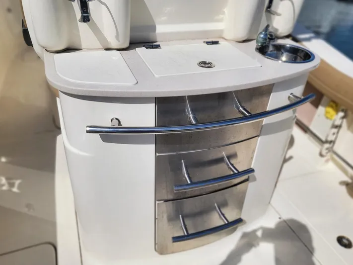  Yacht Photos Pics 2018 Scout 275 LXF boat interior with storage drawers and sink.