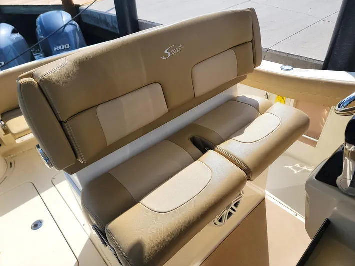  Yacht Photos Pics 2018 Scout 275 LXF boat interior with tan seating and dual outboard engines.