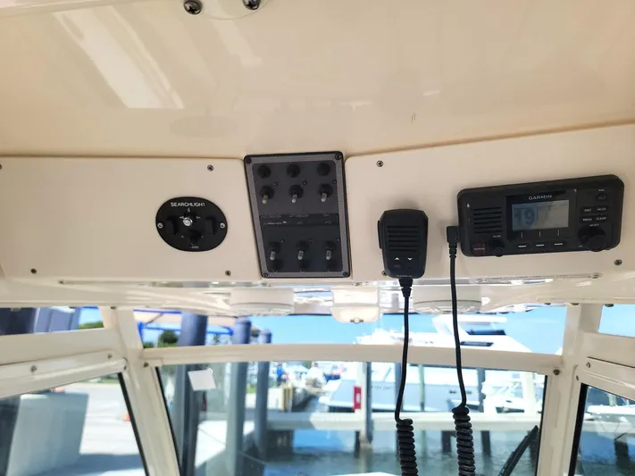  Yacht Photos Pics 2018 Scout 275 LXF boat dashboard with Garmin device and control panel.