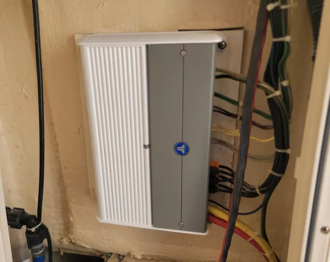  Yacht Photos Pics Electrical panel with multiple wires, mounted on a wall, in a 2018 Scout 275 LXF boat.