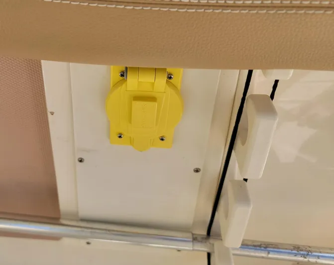  Yacht Photos Pics Yellow electrical outlet on 2018 Scout 275 LXF boat interior.