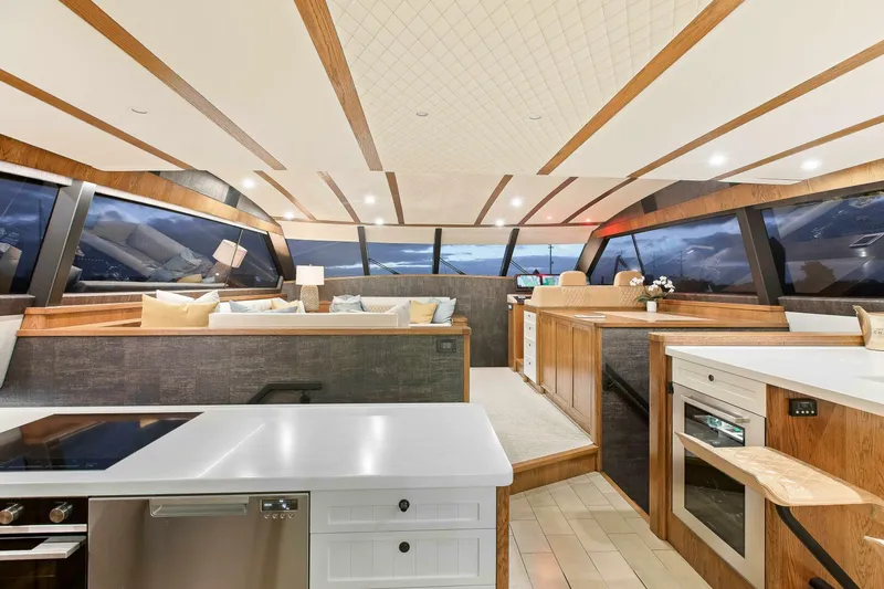 "the Keys" Yacht Photos Pics Luxurious interior of 2021 Valder Yachts Powercat with modern kitchen and panoramic windows.