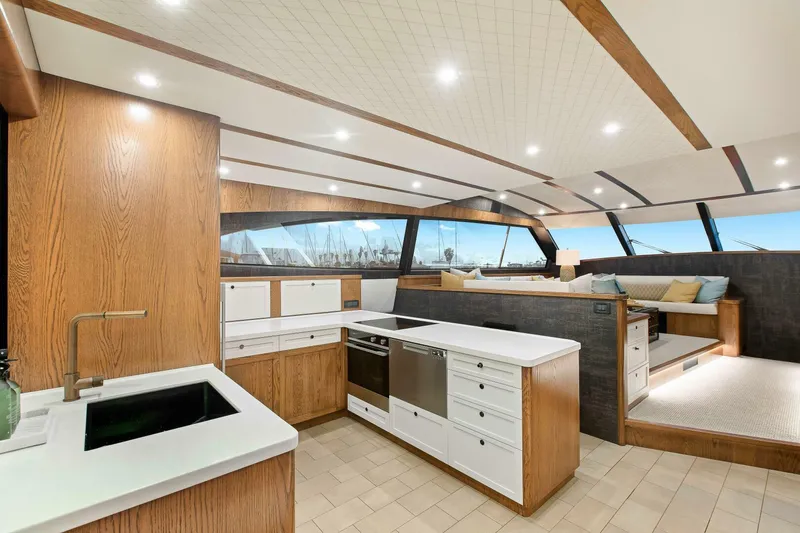 "the Keys" Yacht Photos Pics Luxurious interior of 2021 Valder Yachts Powercat with modern kitchen and seating area.