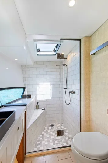 "the Keys" Yacht Photos Pics Luxurious bathroom in 2021 Valder Yachts Powercat with modern shower and sleek design.
