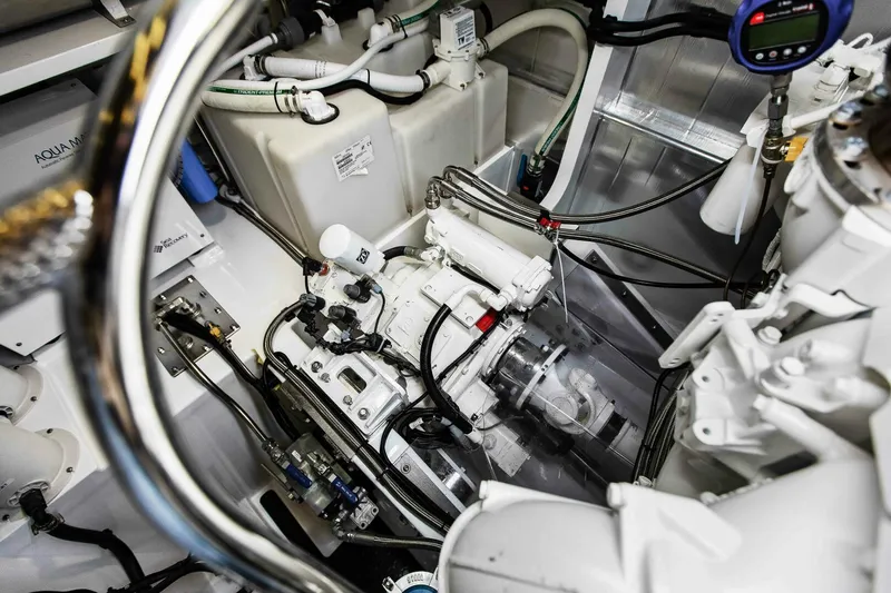 "the Keys" Yacht Photos Pics Engine room of 2021 Custom Valder Yachts Powercat, showcasing mechanical components and wiring.