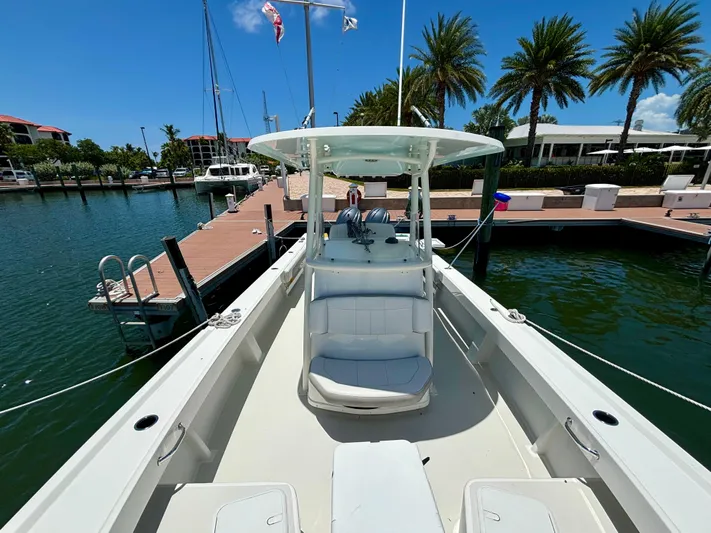  Yacht Photos Pics 2022 Parker 2801 Center Console boat docked at a marina with palm trees.