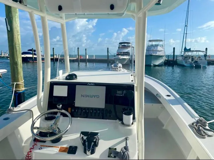  Yacht Photos Pics 2022 Parker 2801 Center Console boat with Garmin navigation at a marina.