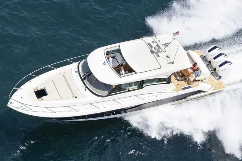  Yacht Photos Pics Manufacturer Provided Image: 2025 Tiara Yachts 48 LE cruising on open water, showcasing sleek design and powerful engines.