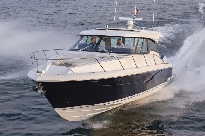  Yacht Photos Pics Manufacturer Provided Image: 2025 Tiara Yachts 48 LE cruising on open water, showcasing sleek design and performance.