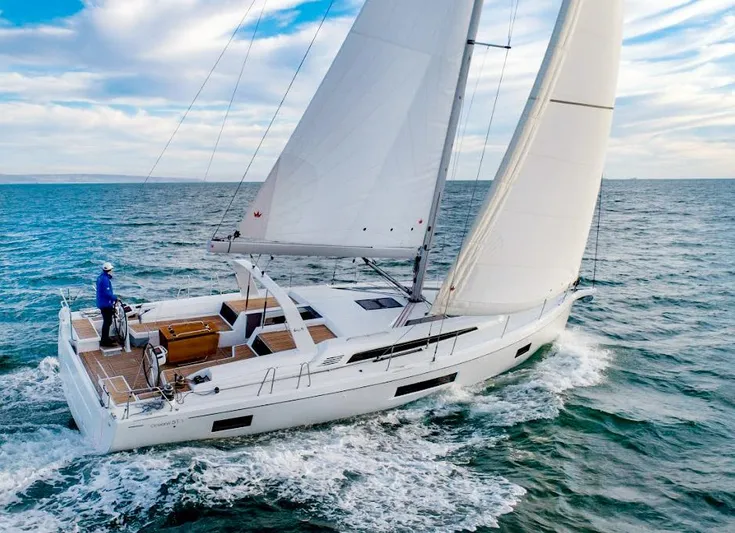 Betwixt Yacht Photos Pics Sailing yacht Beneteau Oceanis 51.1, 2022 model, cruising on open sea.