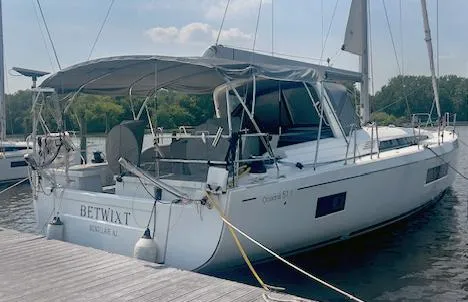 Betwixt Yacht Photos Pics 2022 Beneteau Oceanis 51.1 yacht docked at marina, rear view.