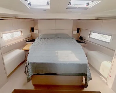 Betwixt Yacht Photos Pics Luxurious cabin interior of 2022 Beneteau Oceanis 51.1 yacht with skylights and modern design.
