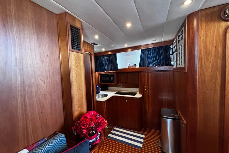 True Grit Yacht Photos Pics Luxurious 2003 Apreamare 40 yacht interior with wood finish and modern amenities.