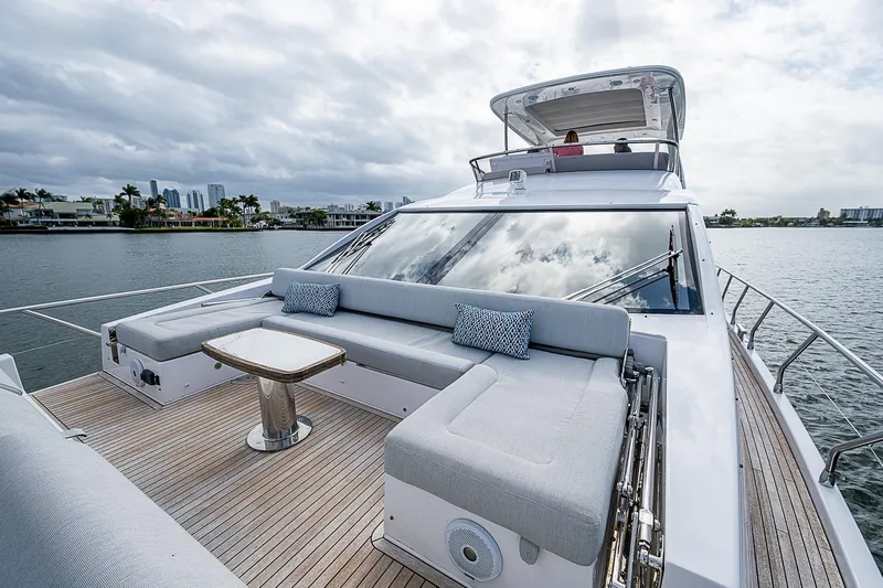 Liquid Asset Yacht Photos Pics Luxurious 2020 Azimut 66 yacht with spacious deck and seating area on the water.