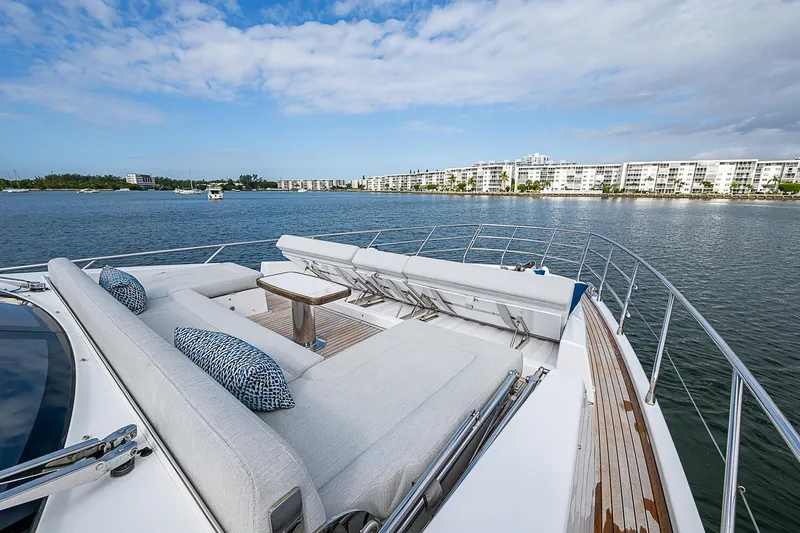 Liquid Asset Yacht Photos Pics Luxurious 2020 Azimut 66 yacht with spacious deck and scenic waterfront view.