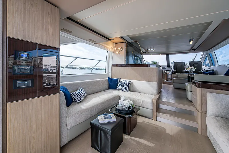 Liquid Asset Yacht Photos Pics Luxurious interior of 2020 Azimut 66 yacht with modern seating and panoramic windows.
