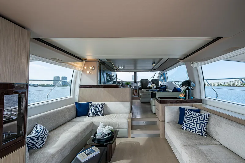 Liquid Asset Yacht Photos Pics Luxurious interior of 2020 Azimut 66 yacht with elegant seating and panoramic windows.