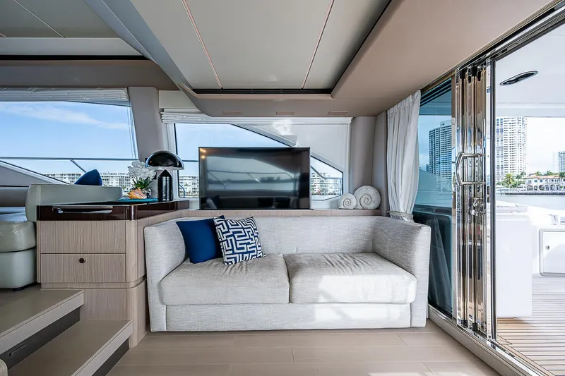 Liquid Asset Yacht Photos Pics Luxurious interior of 2020 Azimut 66 yacht with modern sofa and large windows.