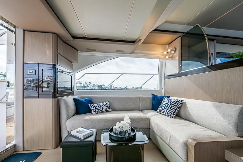 Liquid Asset Yacht Photos Pics Luxurious interior of 2020 Azimut 66 yacht with modern seating and decor.