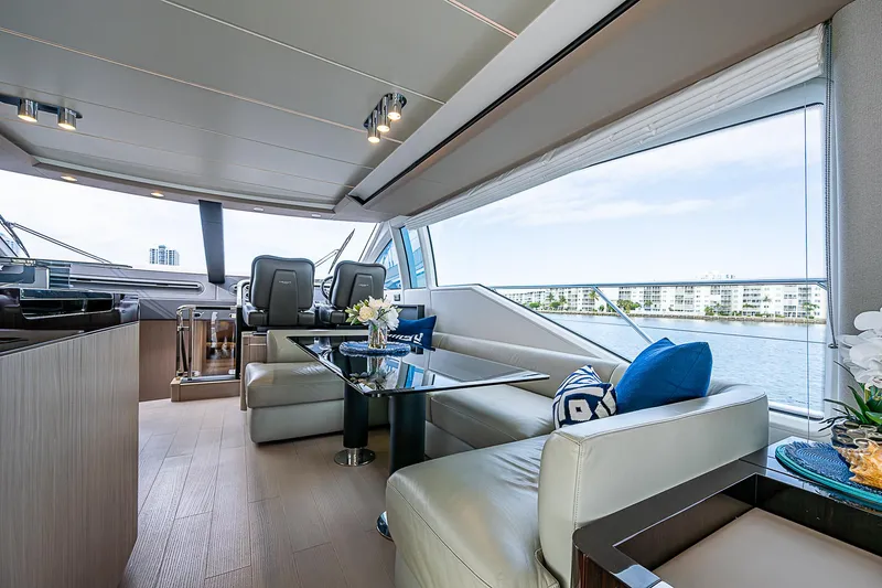 Liquid Asset Yacht Photos Pics Luxurious interior of 2020 Azimut 66 yacht with elegant seating and panoramic windows.