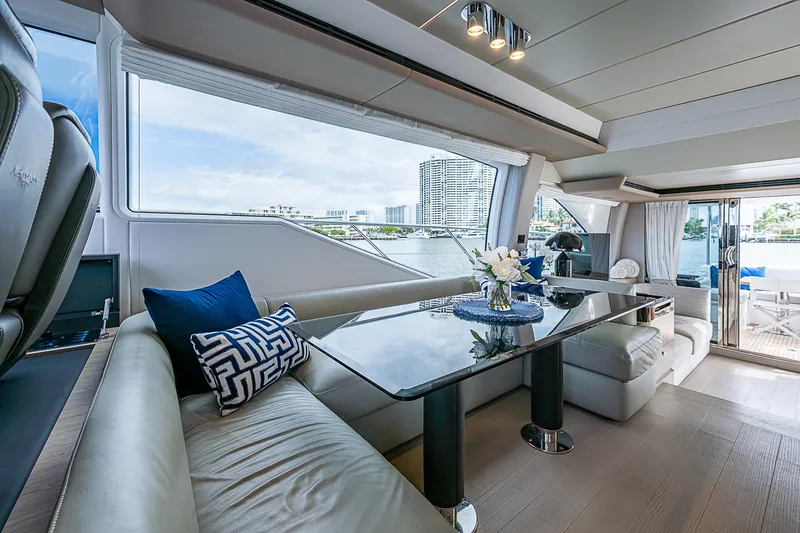 Liquid Asset Yacht Photos Pics Luxurious interior of 2020 Azimut 66 yacht with elegant seating and modern decor.