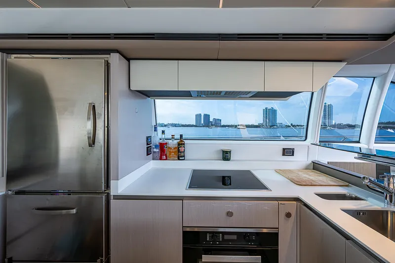 Liquid Asset Yacht Photos Pics Modern kitchen interior on 2020 Azimut 66 yacht with ocean view.