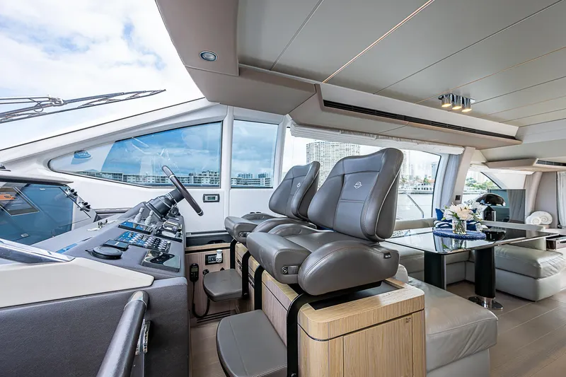 Liquid Asset Yacht Photos Pics Luxurious interior of 2020 Azimut 66 yacht with modern helm and seating.