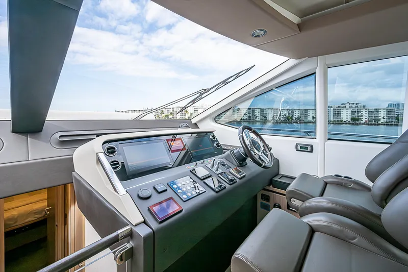 Liquid Asset Yacht Photos Pics Luxurious 2020 Azimut 66 yacht cockpit with modern navigation controls and panoramic view.