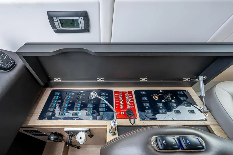 Liquid Asset Yacht Photos Pics Control panel of a 2020 Azimut 66 yacht, featuring advanced navigation and system controls.