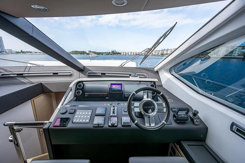 Liquid Asset Yacht Photos Pics Interior view of 2020 Azimut 66 yacht cockpit with modern navigation controls.