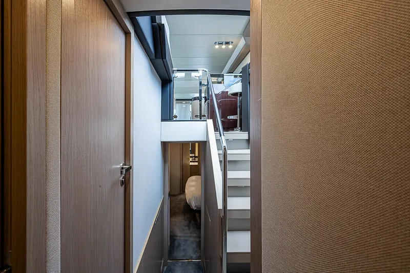 Liquid Asset Yacht Photos Pics Interior view of 2020 Azimut 66 yacht, featuring modern staircase and sleek design.