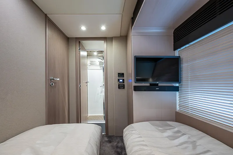Liquid Asset Yacht Photos Pics Luxurious Azimut 66 yacht cabin interior with twin beds and modern amenities, 2020 model.