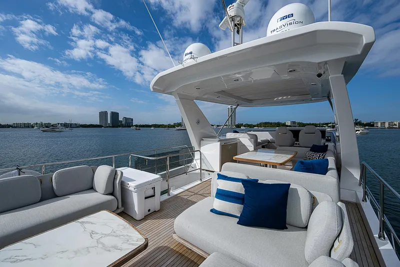Liquid Asset Yacht Photos Pics Luxurious 2020 Azimut 66 yacht deck with elegant seating and scenic water view.