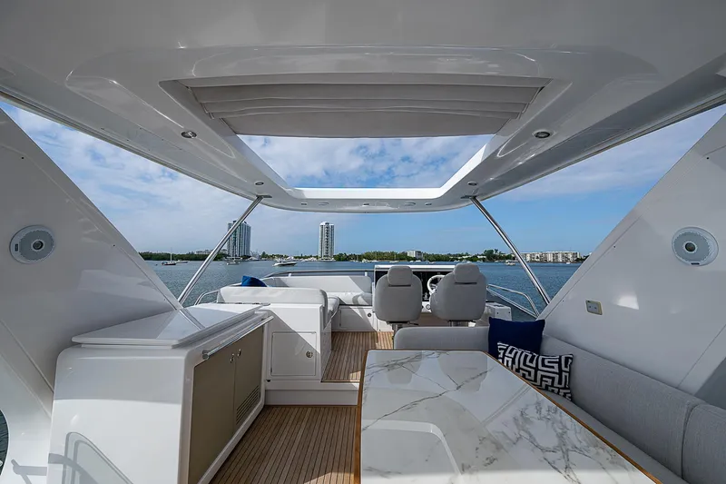 Liquid Asset Yacht Photos Pics Luxurious 2020 Azimut 66 yacht interior with modern design and ocean view.