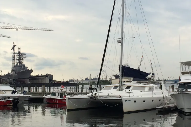 Seapaws Yacht Photos Pics Voyage Yachts 470 catamaran docked at a marina, 1996 model.