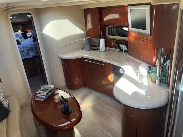  Yacht Photos Pics Luxurious interior of 2003 Sea Ray 420 Sundancer yacht with modern kitchen amenities.